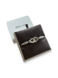 Bracelet Menottes R12 Dinh Van en argent 925/1000 dans son écrin, vue d’ensemble